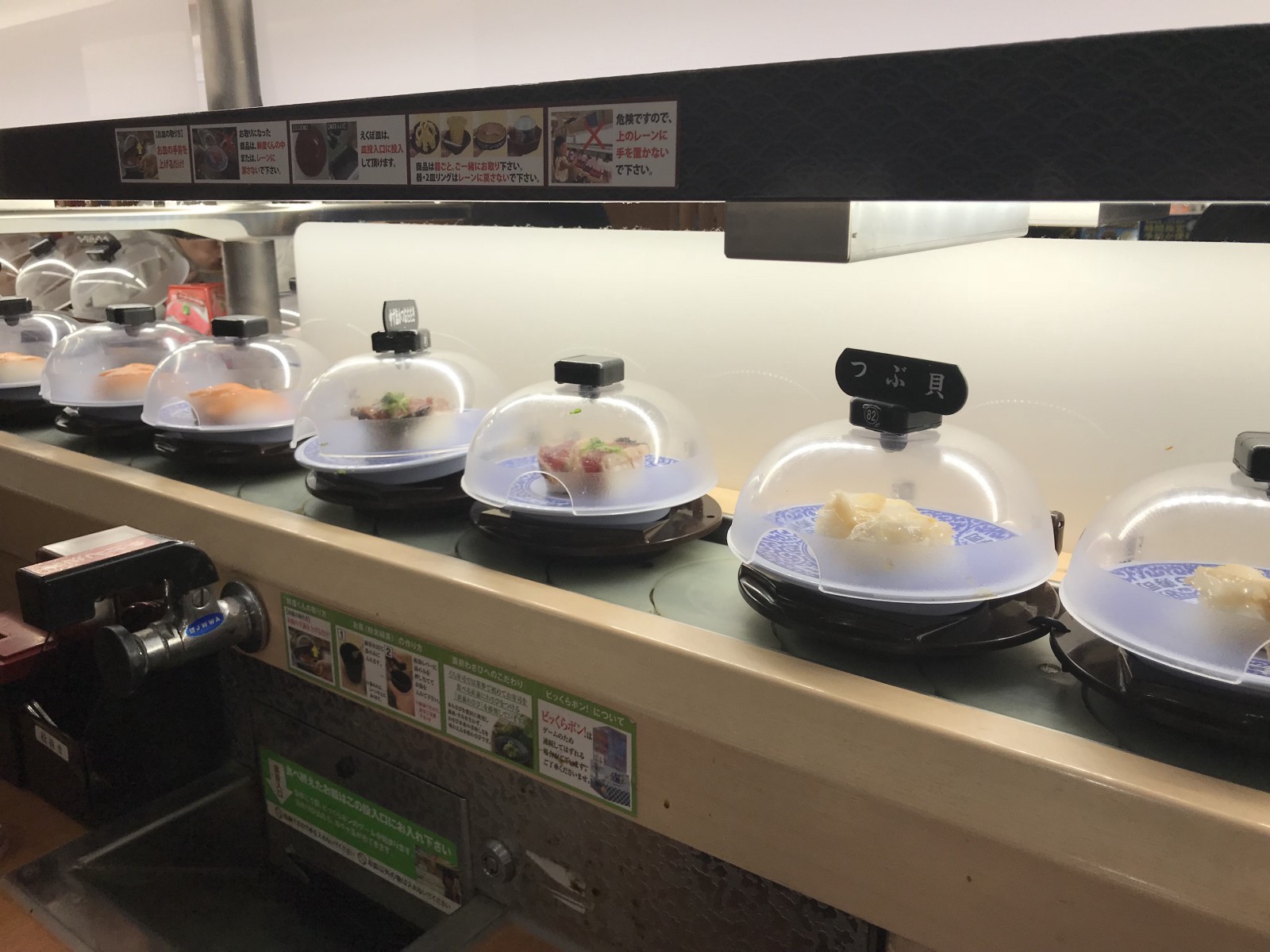 Sushi on a belt conveyor at Kura Sushi