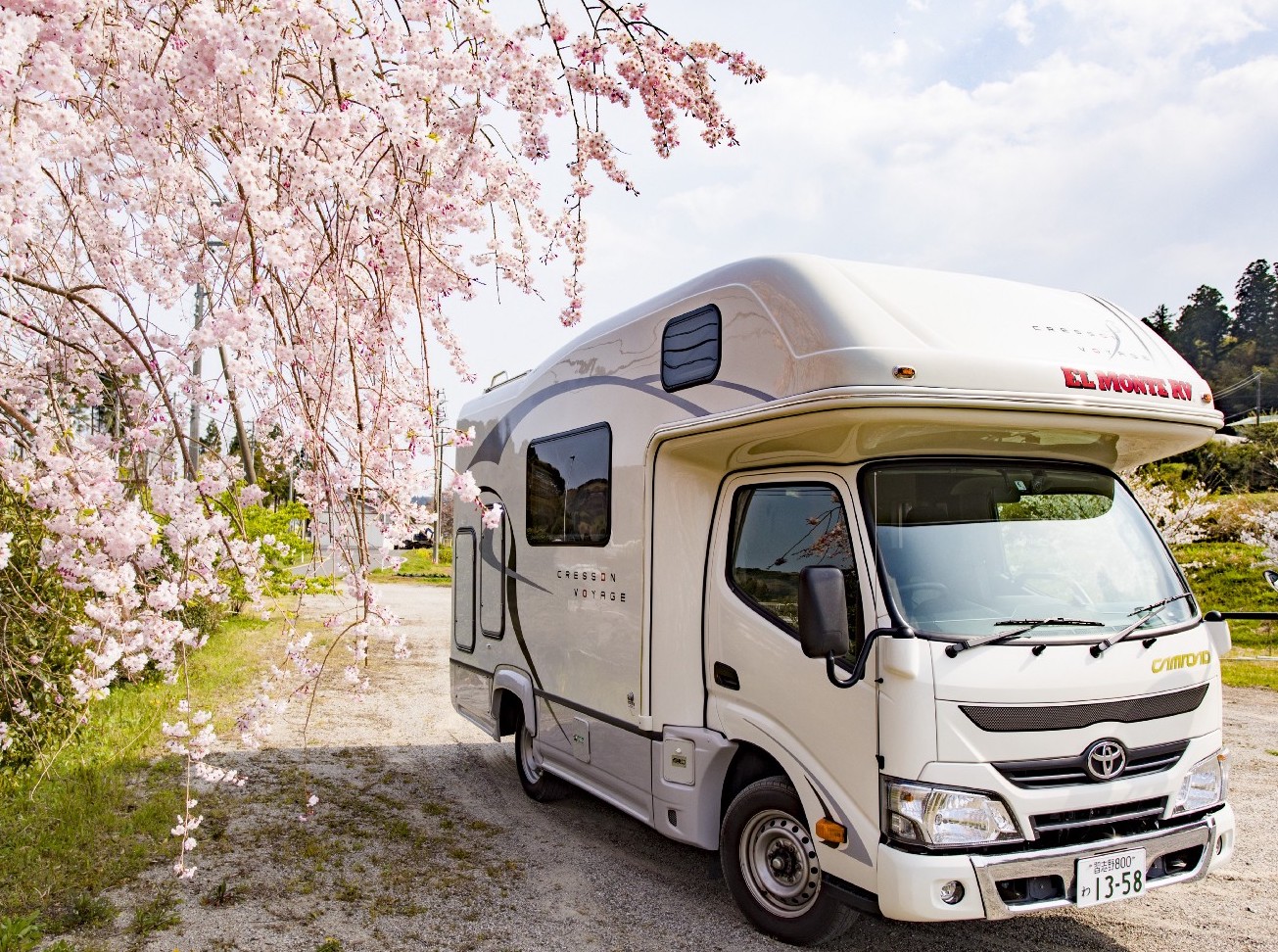 RV with cherry blossoms