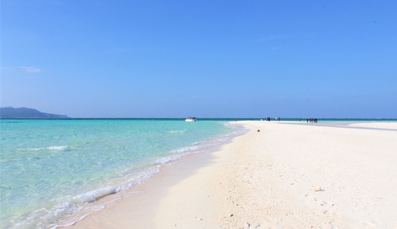 The beach on Kume island with pure white sand with clear blue water 