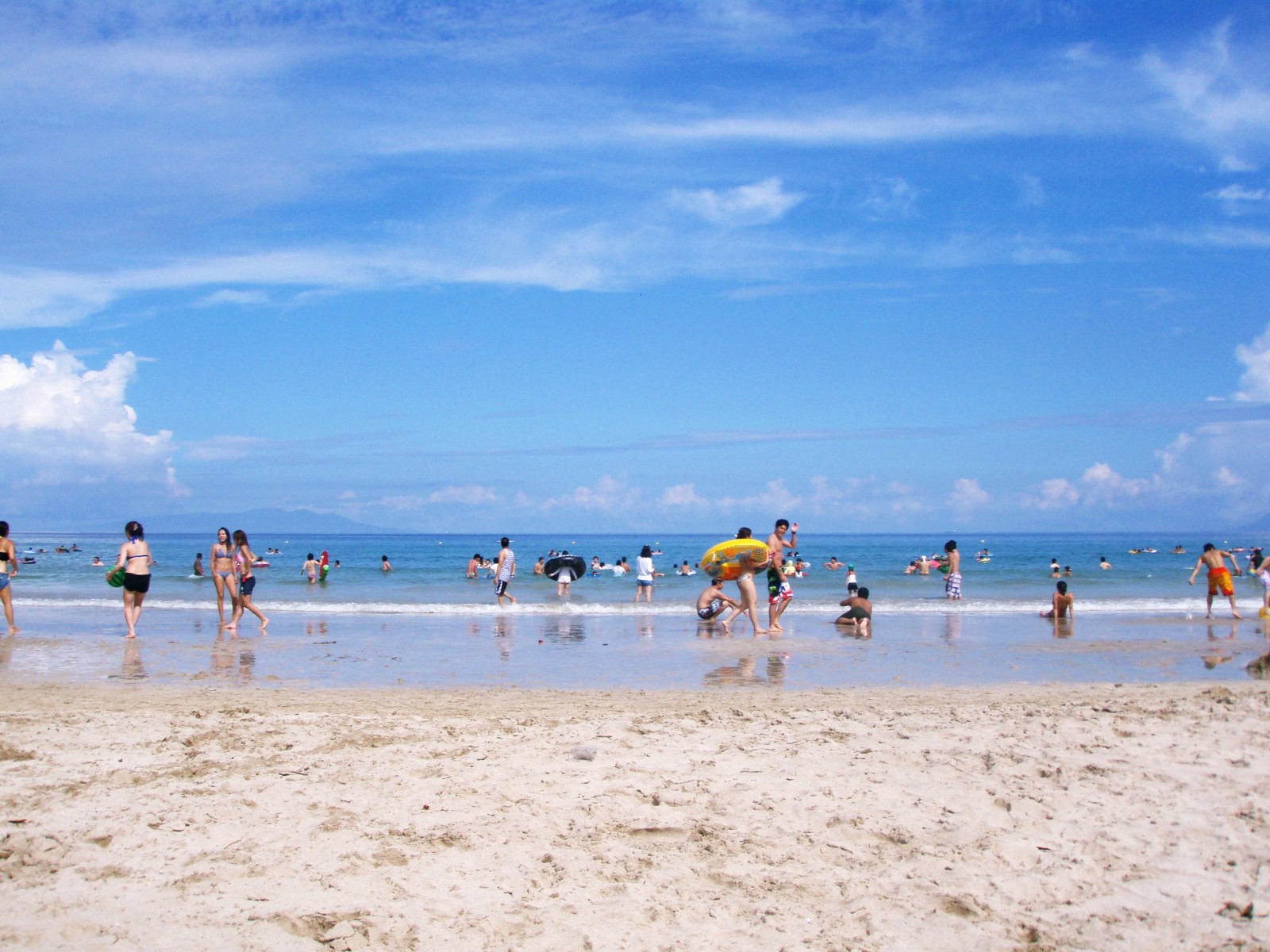 Beach in summer crowded by visitors