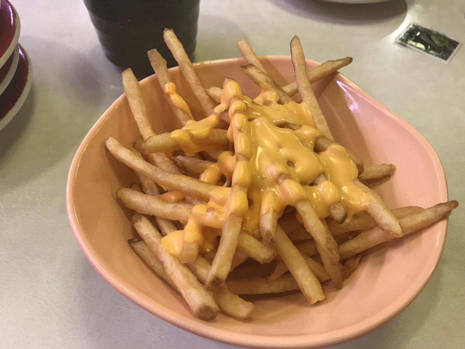 Freshly made french fries with melted cheese