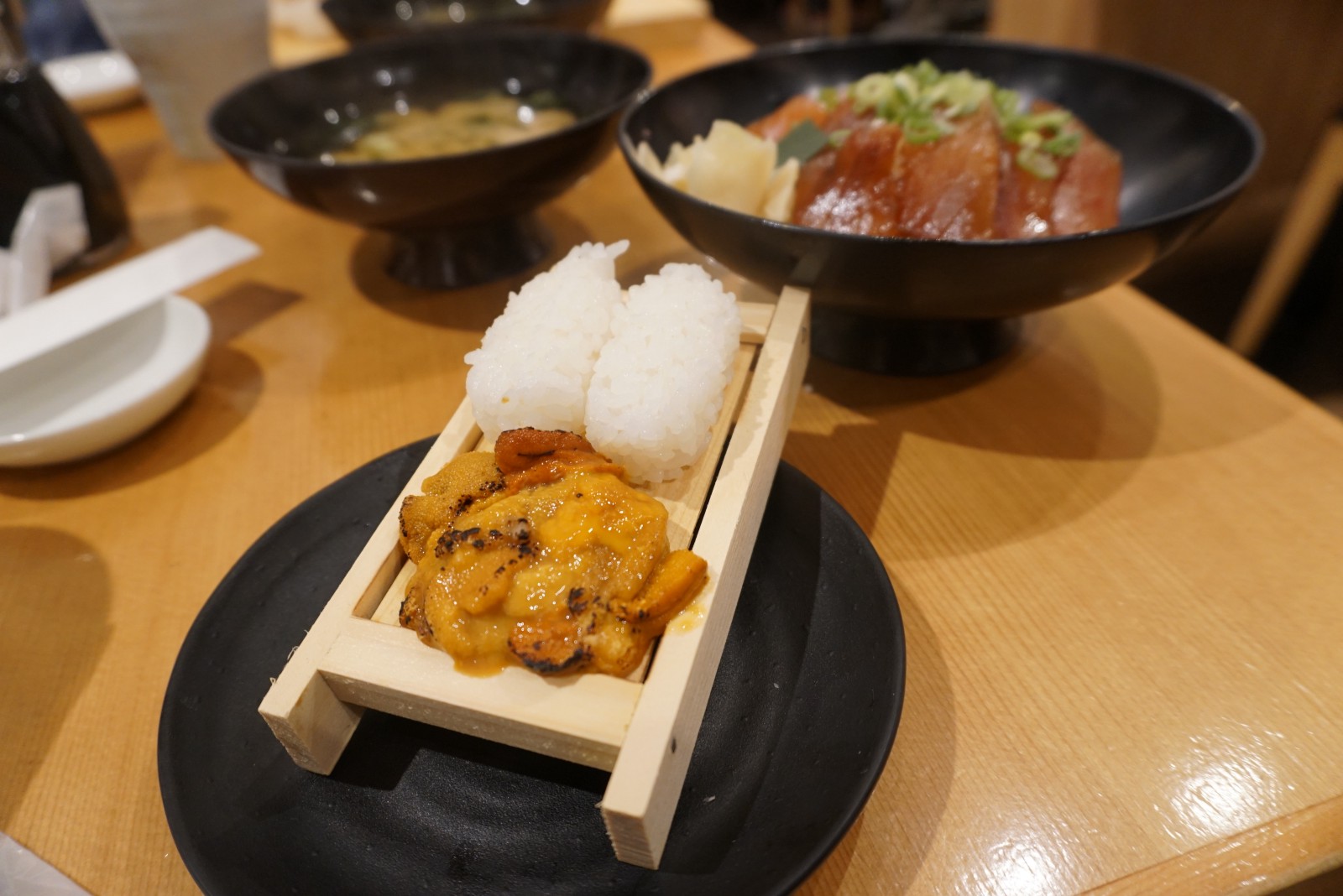 Lightly grilled Sea Urchin "Uni" served with vinegared rice