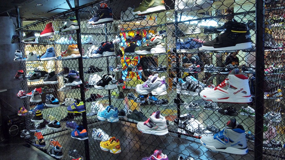 Cool sneakers displayed hung on the fence at Mita Sneaker