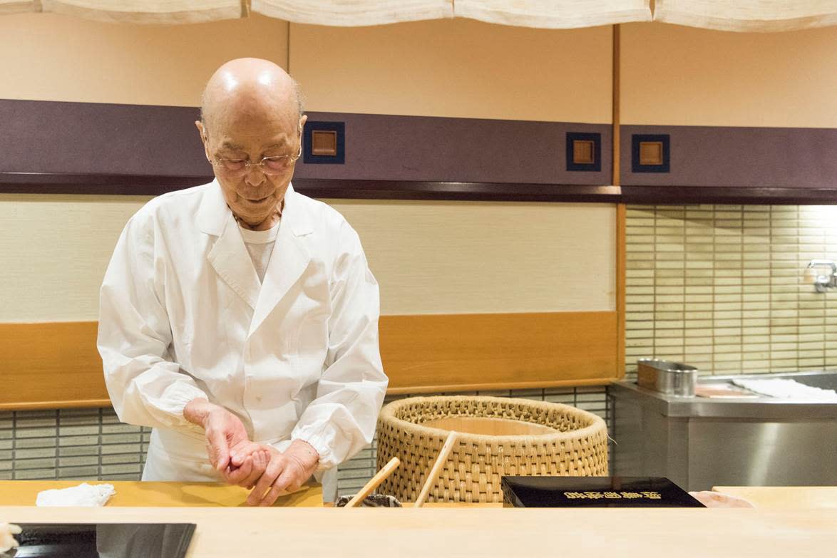 The legendary Sushi master Jiro Ono is making a piece of sushi