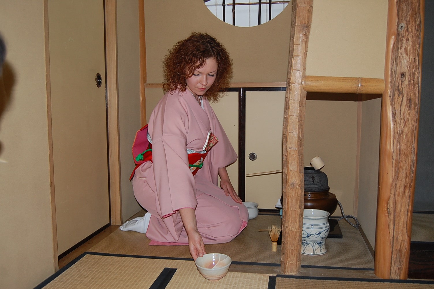 A woman enjoys the tea ceremony