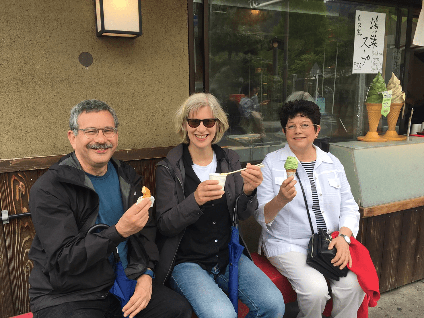 People eating Japanese Matcha snacks in Kyoto