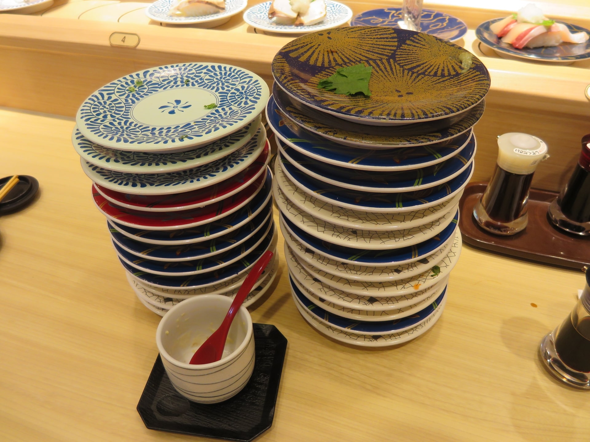 stacked plates at sushi restaurant