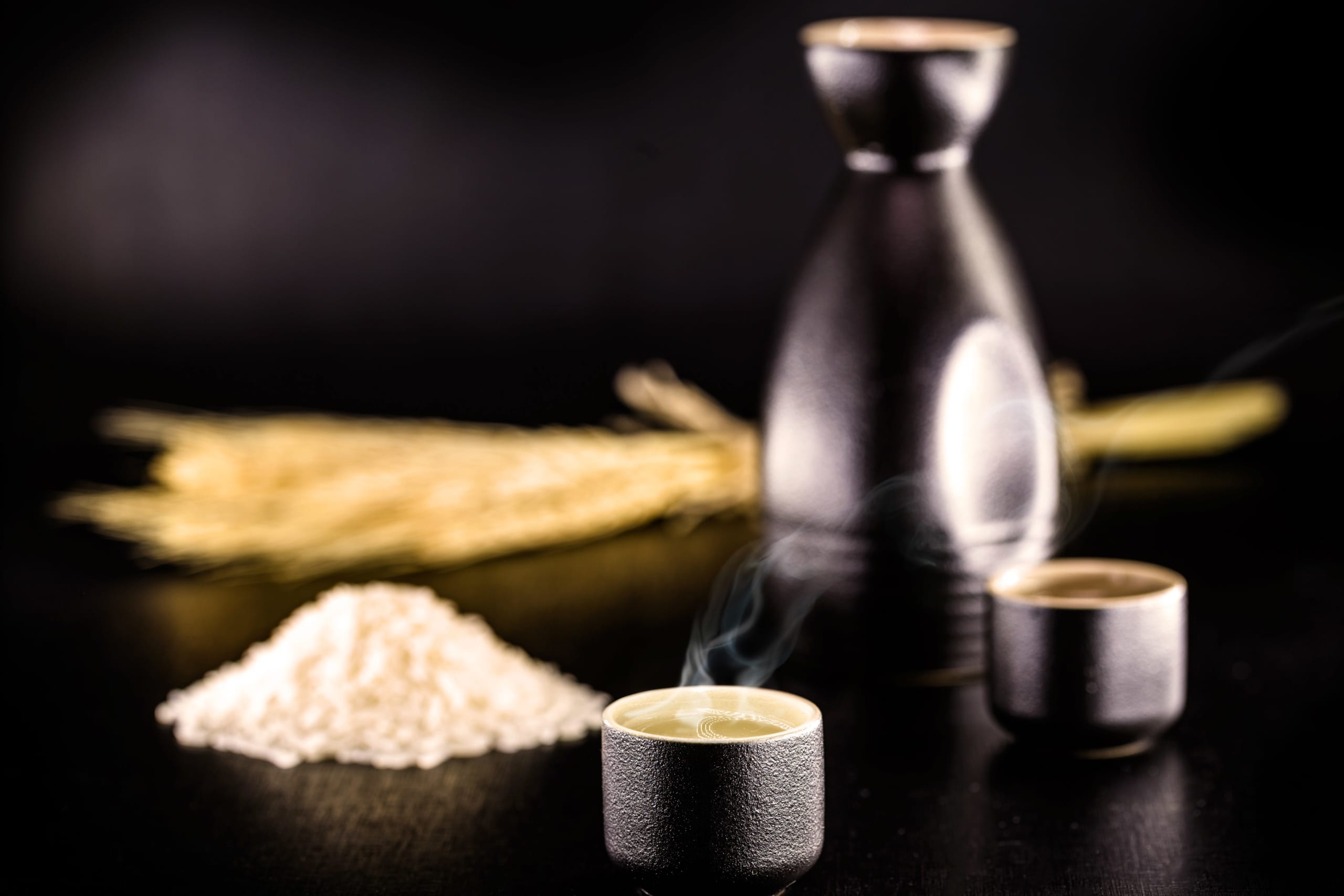 sake cup and rice grains