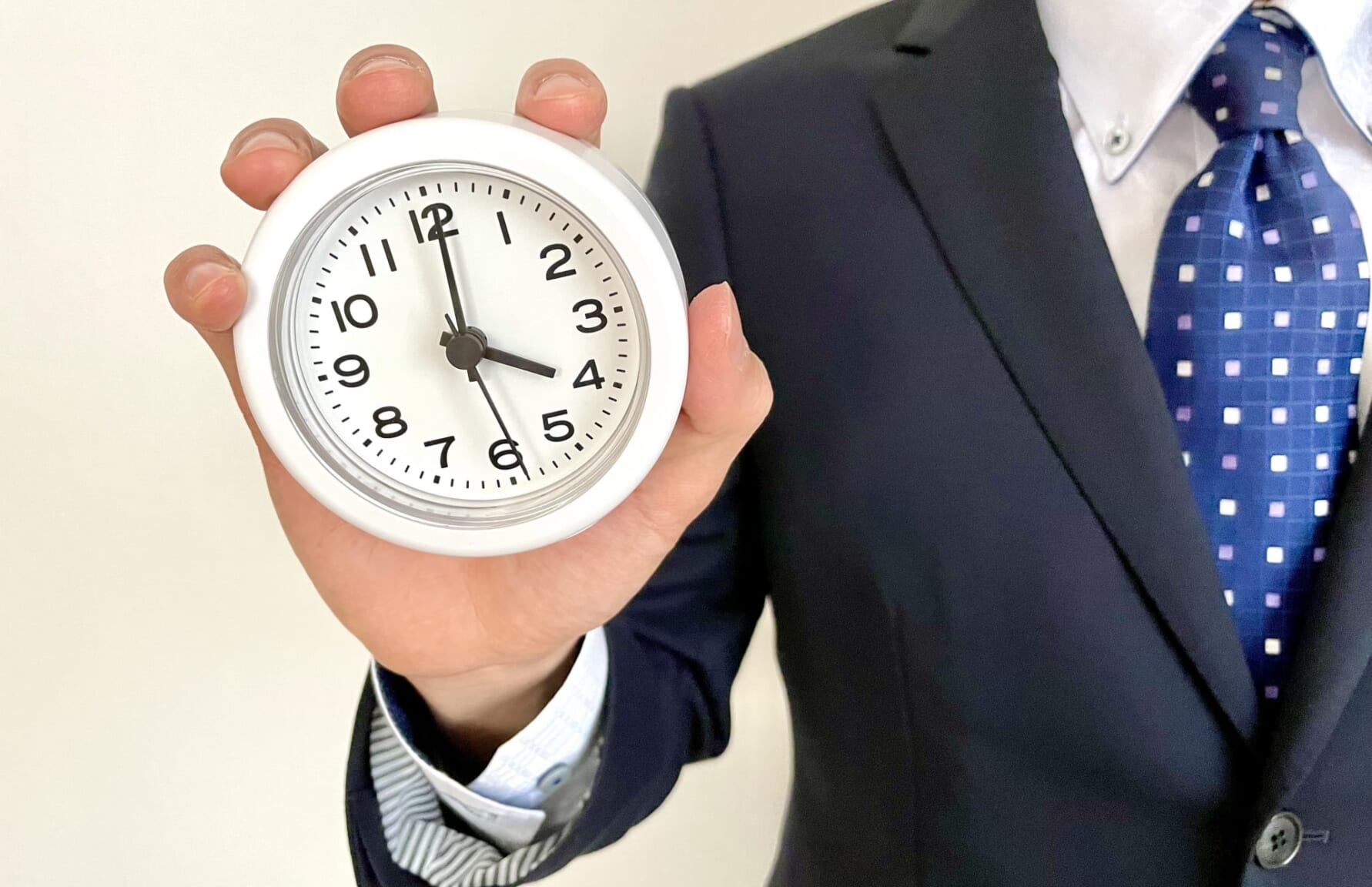 man holding a clock