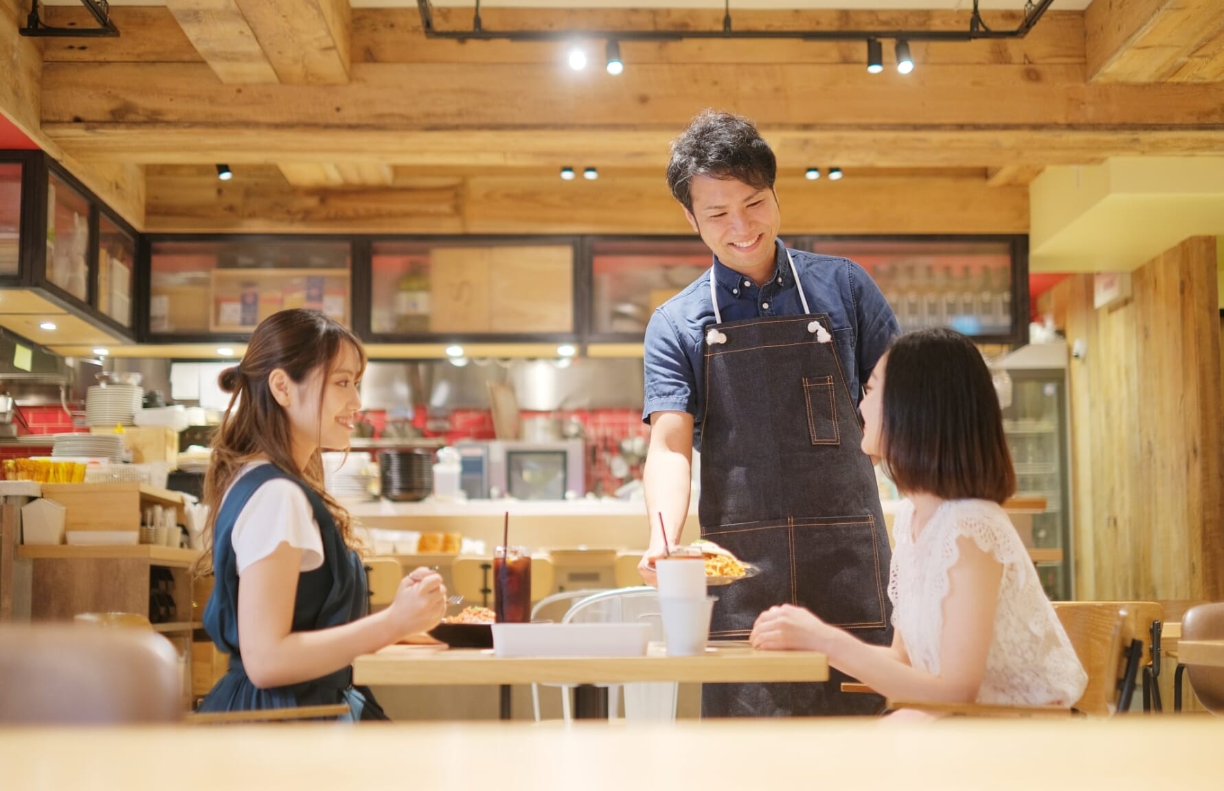 Clients at a restaurant with server