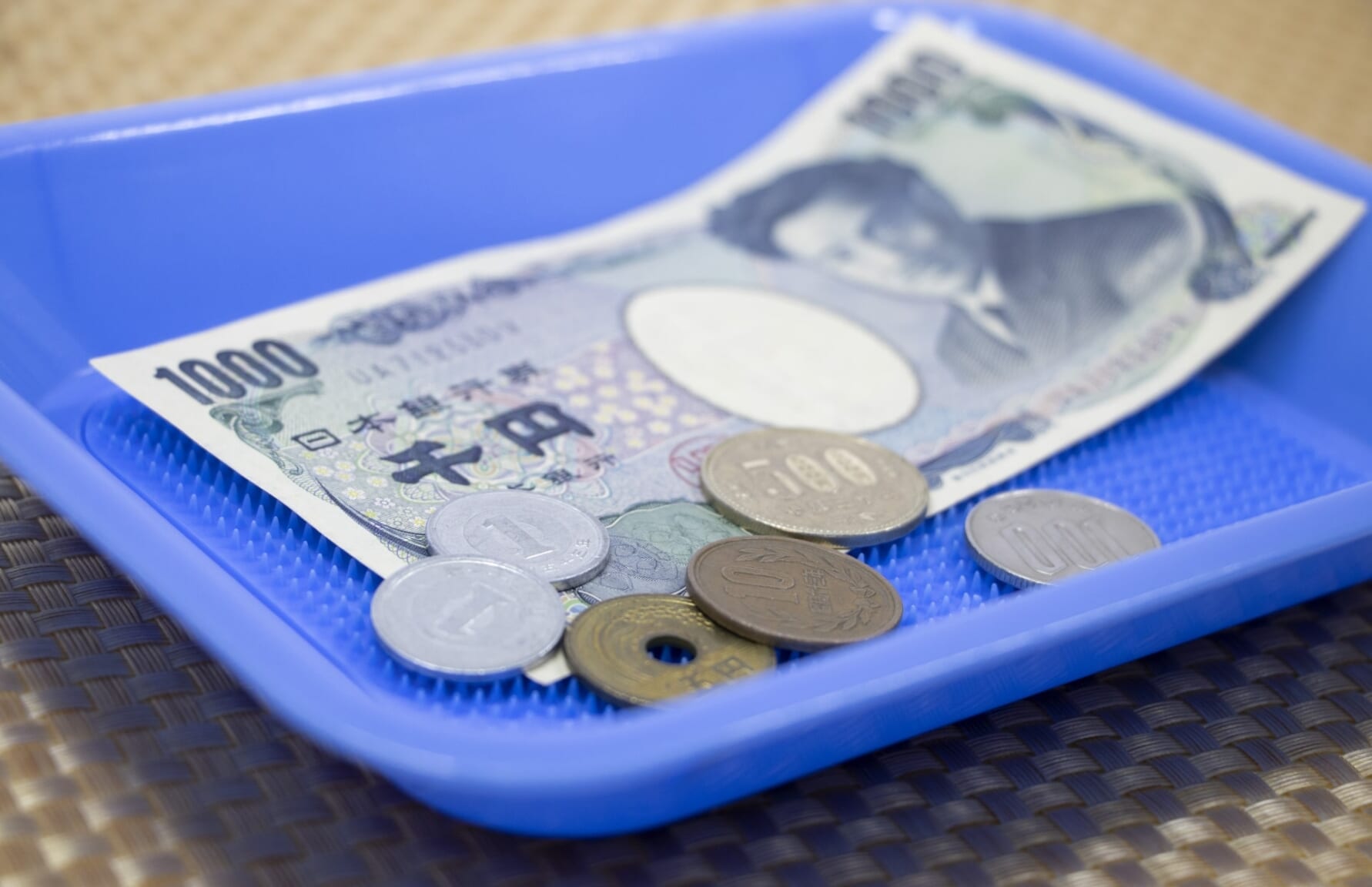 Plastic tray for money in Japan