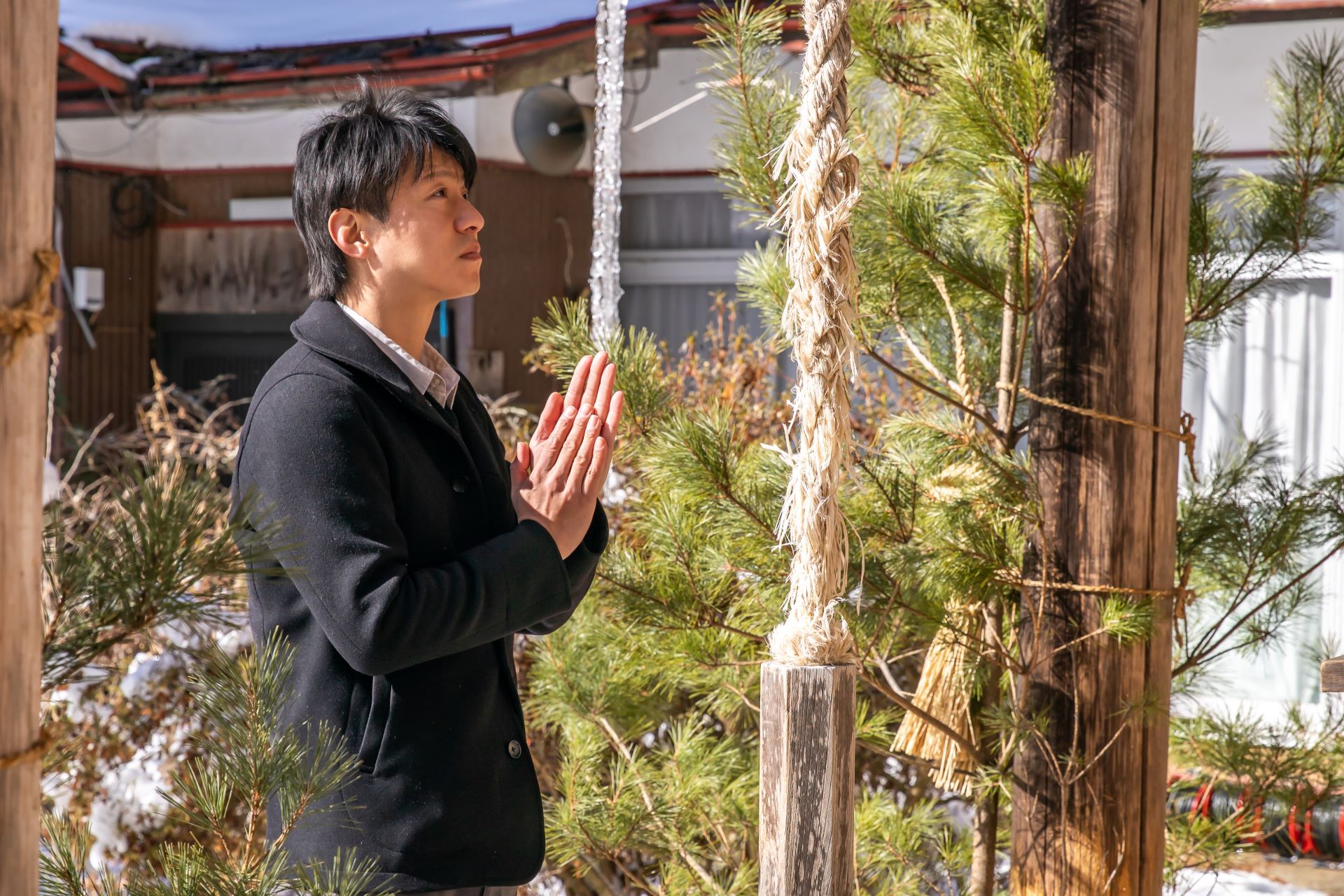 Man praying at a shrine