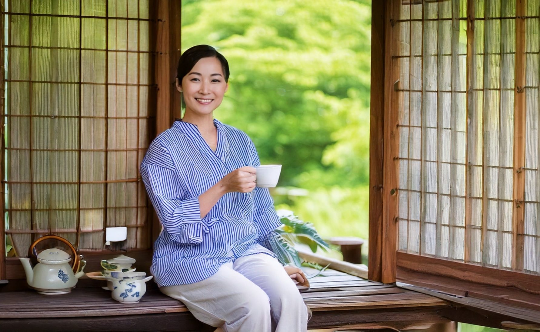 Woman drinking green tea