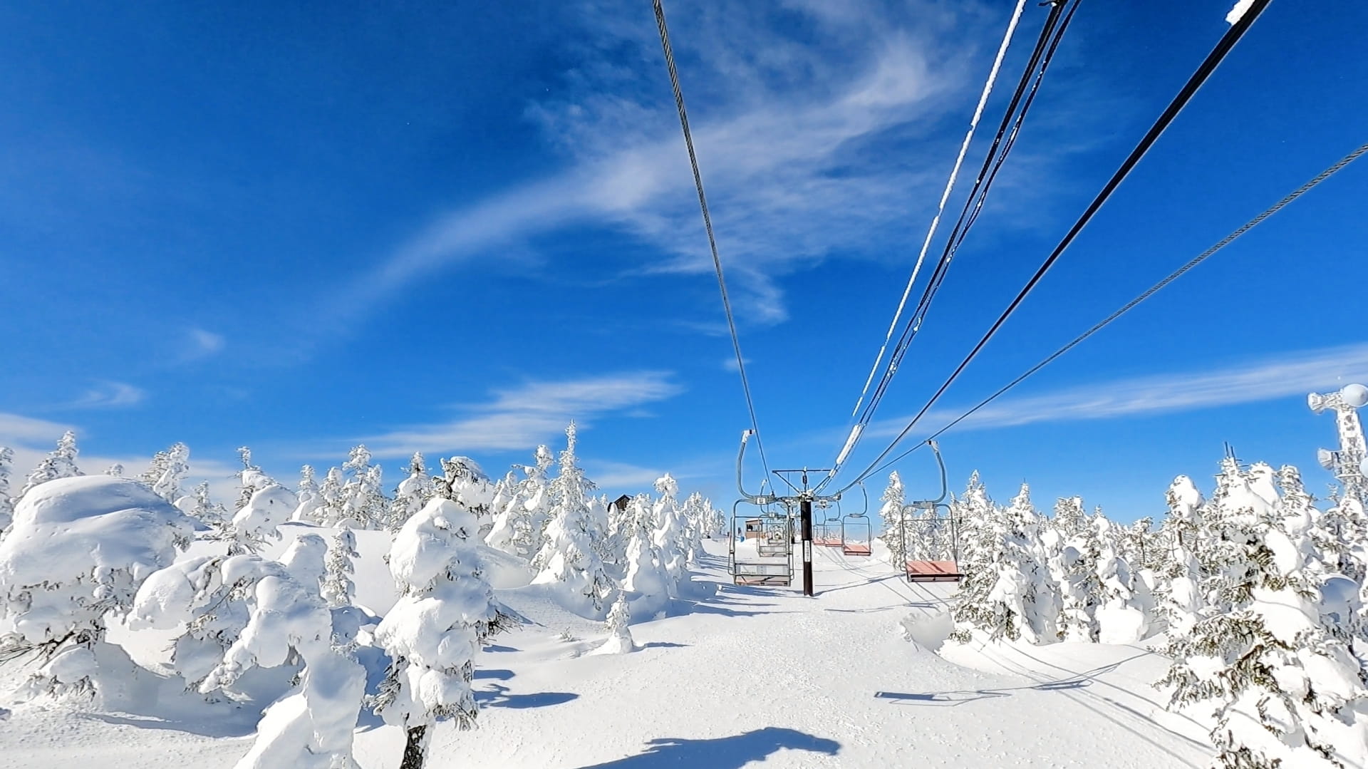 Ski lift at Shiga Kogen with Snow Monsters on the background