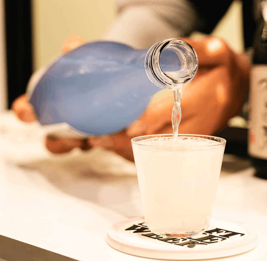 Japanese Sake being poured in a glass cup