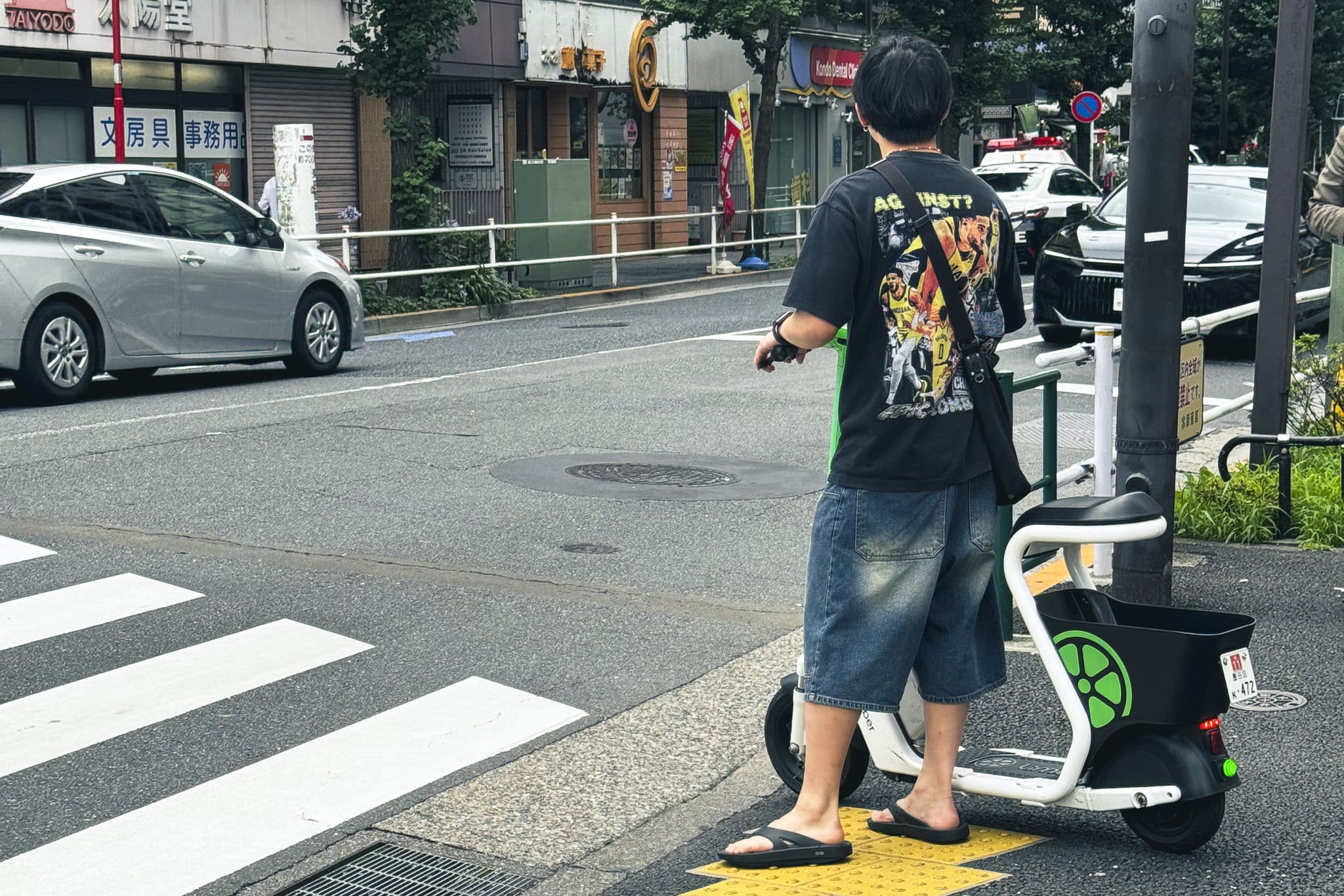 e-scooter user walking on the sidewalk