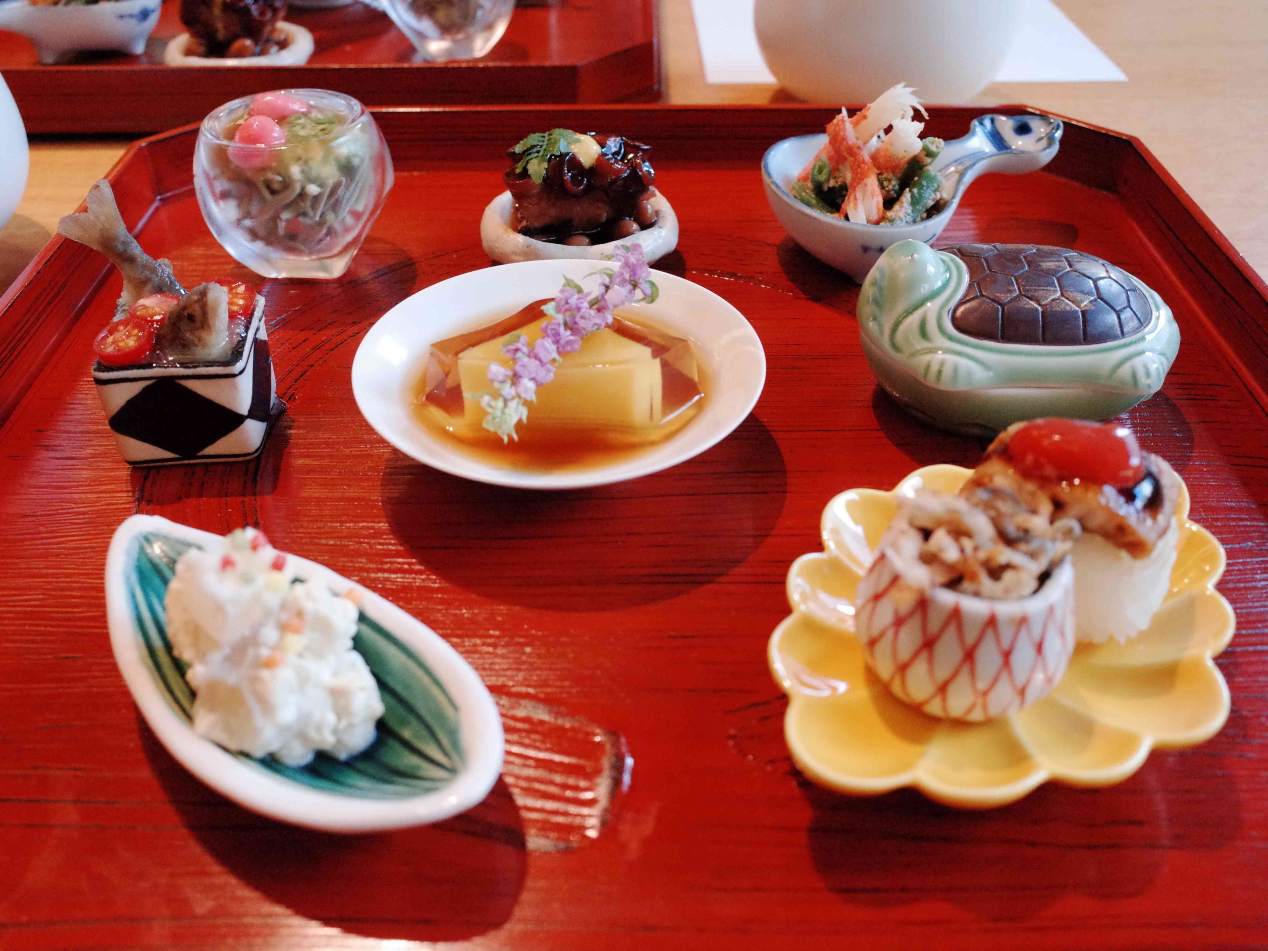 Kaiseki appetizer platter with hamo sushi and junsai at UNKAI Tokyo